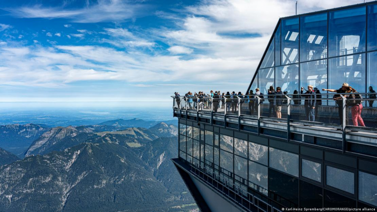 "Alpine Paradox: Balancing Tourist Trails with Climate Crisis"