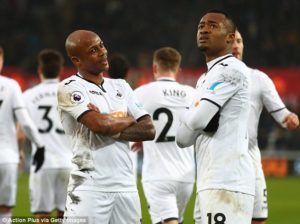 Andre Ayew (left) and Jordan Ayew celebrate in Swansea's 4-1 victory over West Ham