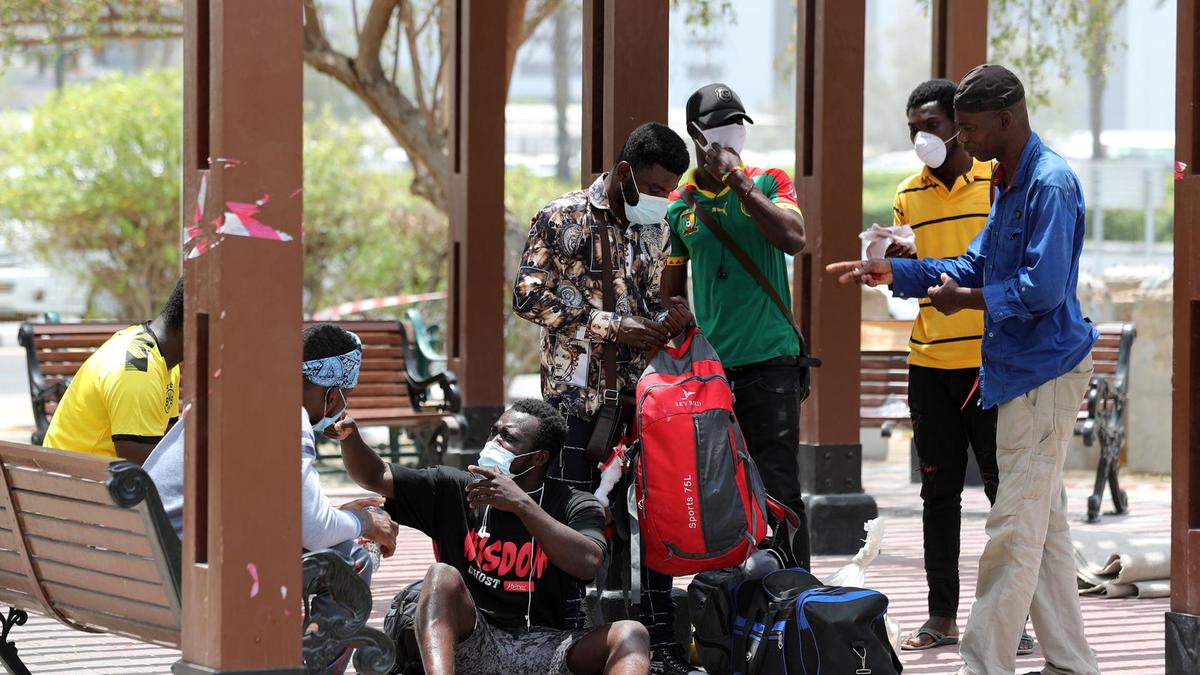 he homeless and jobless people from Ghana gather at a park in Dubai's Satwa district. 