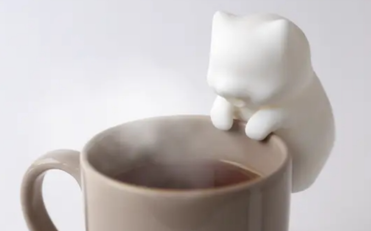 Tiny Robot Cat Keeps Your Coffee Cool and Your Lips Safe