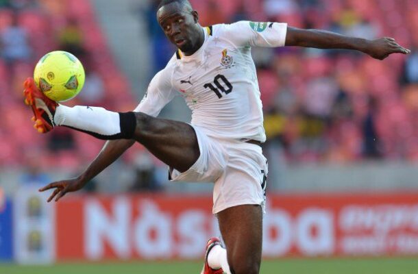 IMG_0359 | Ghanaguardian.com Ghanaian footballer wearing number 10, in white kit, jumping to kick a bright yellow ball in a stadium match