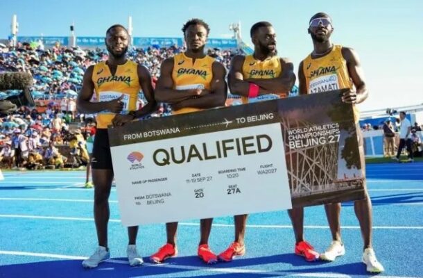 Four Ghanaian sprinters on a blue track hold a large banner that reads 'QUALIFIED' for the World Athletics Championships in Beijing, with the slogan 'From Botswana to Beijing.'
