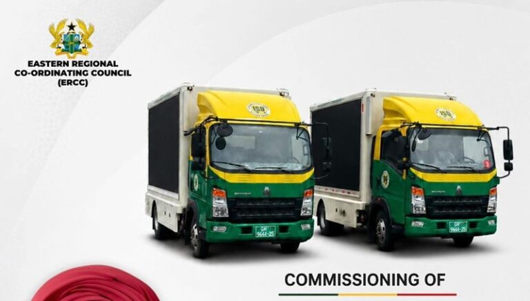 Two green-and-yellow delivery trucks side by side on a white background for an ERCC commissioning event, with near-top-left ERCC branding.