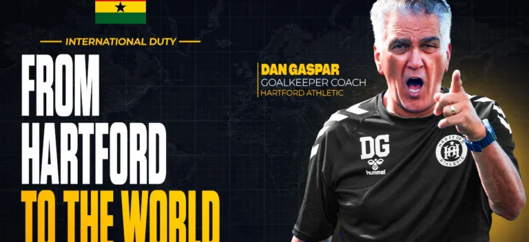 Sports promo banner showing Dan Gaspar, Hartford Athletic goalkeeping coach, shouting and pointing, with large text 'From Hartford to the World' and a Ghana flag above.