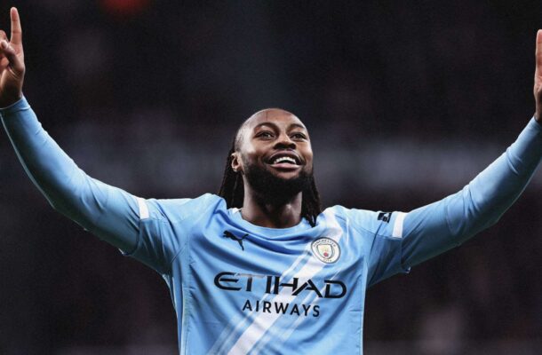 IMG_0485 | Ghanaguardian.com Footballer in Manchester City kit with arms raised in celebration on the pitch.
