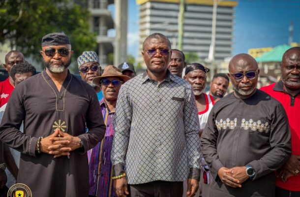 IMG_0501 | Ghanaguardian.com Group of men standing together outdoors for a photo, with buildings in the background.