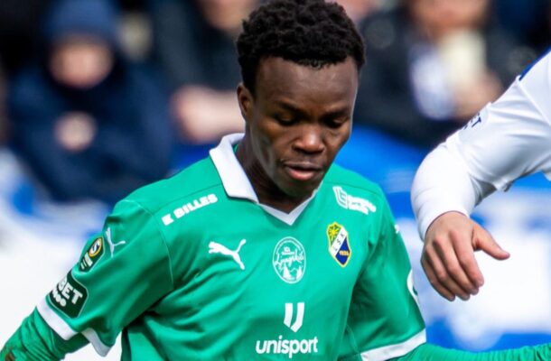 IMG_0521 | Ghanaguardian.com Soccer player in a green jersey with sponsor and club badges, focused on the ball during a match.