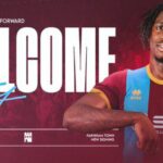 Club welcome poster for a new signing, with a smiling footballer in a maroon and light-blue kit and a large 'WELCOME' headline on a maroon background.