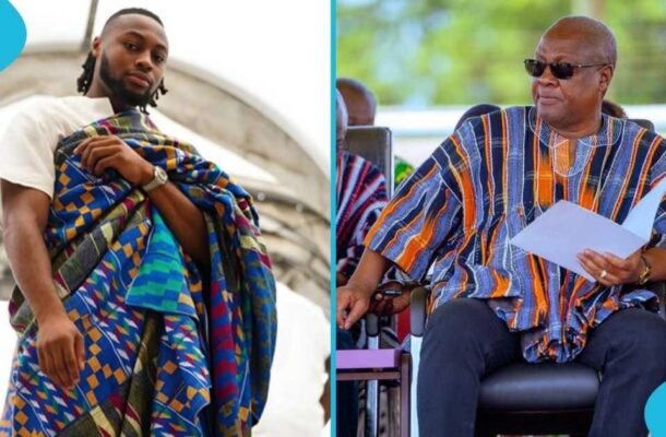 Two men in colorful traditional fabrics: a younger man on the left adjusting a vibrant wrap, an older man on the right in a striped garment holding papers and wearing sunglasses.