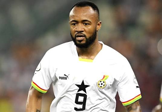 IMG_0635 | Ghanaguardian.com Soccer player in a white jersey with the number 9, on a field during a match, with crest on chest and colorful sleeve trim.