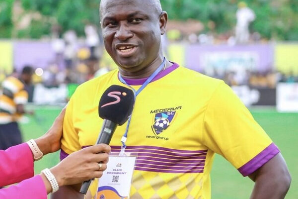IMG_0744 | Ghanaguardian.com Male football player in a yellow jersey being interviewed on a grassy field, microphone held up to him by a reporter.