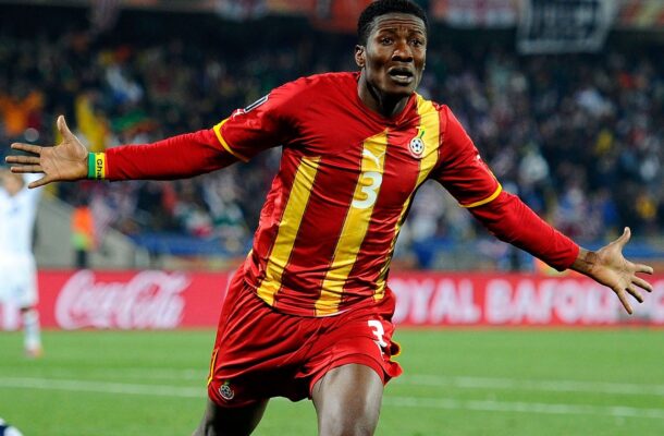 IMG_0745 | Ghanaguardian.com Soccer player in red and yellow stripes celebrating with arms outstretched on the field.