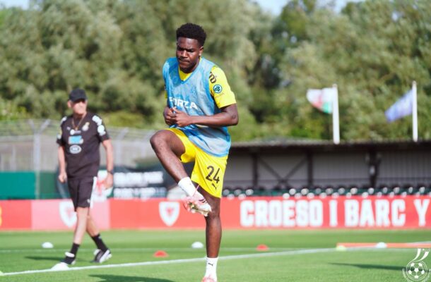 IMG_0760 | Ghanaguardian.com Soccer player wearing yellow shorts and blue training bib mid-air during a drill on a grass field