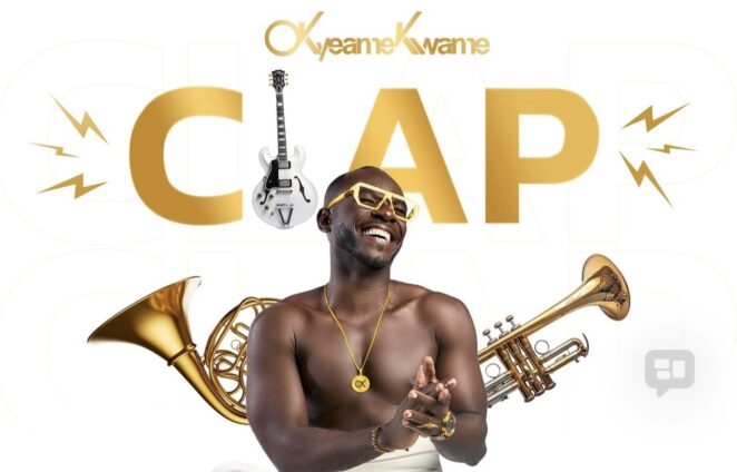 Smiling Black man with gold jewelry, shirtless, surrounded by brass instruments (trumpet, trombone) and a guitar, with a large gold 'CAP' in the background.