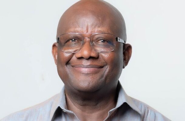 WhatsApp Image 2026-05-23 at 08.45.33 | Ghanaguardian.com Portrait of a smiling bald man wearing glasses in a light striped shirt against a pale background.