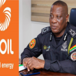 GOIL logo with the slogan 'Good energy' beside a police officer in uniform seated at a desk.