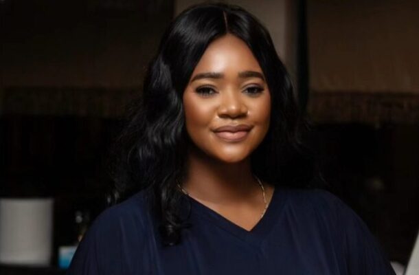 kafui-danku-712x424 | Ghanaguardian.com Portrait of a smiling woman with shoulder-length black hair wearing a navy blouse, looking at the camera.