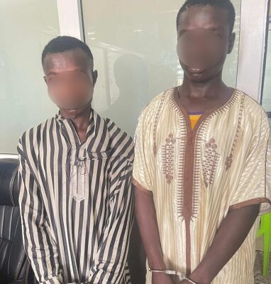 suspected-robbers | Ghanaguardian.com Two men stand side by side indoors with faces blurred for privacy; they wear traditional striped and embroidered robes.