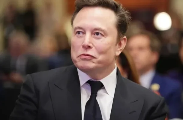 1755068723-8031_1759378040 | Ghanaguardian.com Man in a black suit and tie at a formal event, looking to the side with a neutral expression.