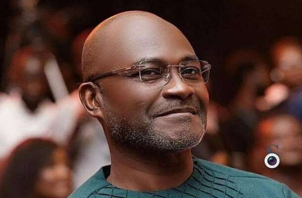 419202423418-1h830n4ayu-kennedy-agyapong1 | Ghanaguardian.com Smiling man with glasses and a salt-and-pepper beard in a teal patterned shirt at a crowded indoor event.