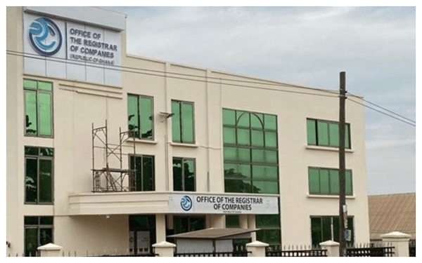 Two-story government building with signs reading 'Office of the Registrar of Companies' and green-tinted windows.