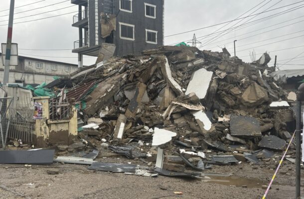 Avenor storey building collapse 3 | Ghanaguardian.com Rubble and debris pile in front of a damaged multi-story building after a collapse, with exposed rebar and broken walls under a cloudy sky