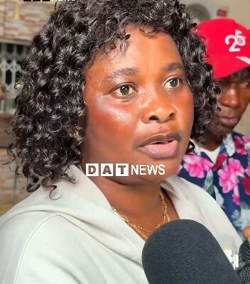 Ghanaian woman | Ghanaguardian.com Close-up of a woman with curly hair speaking to reporters, microphone in foreground, DAT News watermark on screen.