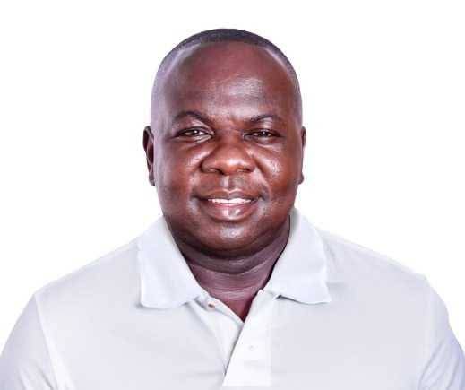 Smiling man in a white polo shirt posing for a portrait against a white background, suitable as a headshot