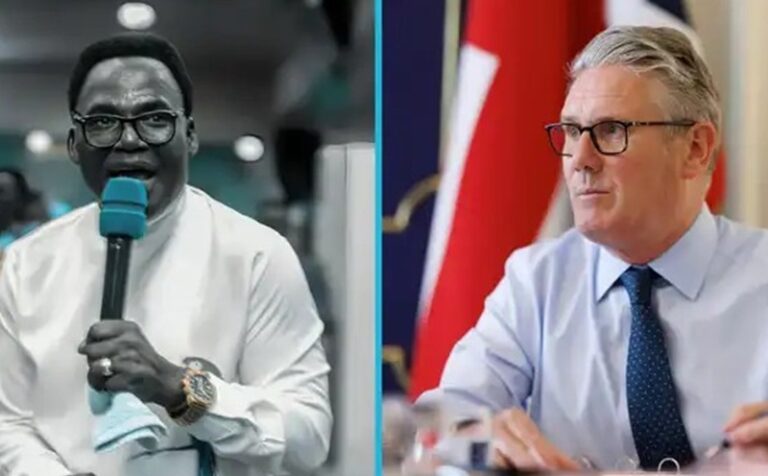Split-screen shows two men: left a speaker with teal microphone and glasses, wearing a white shirt; right a suited official at a table with flags in the background.