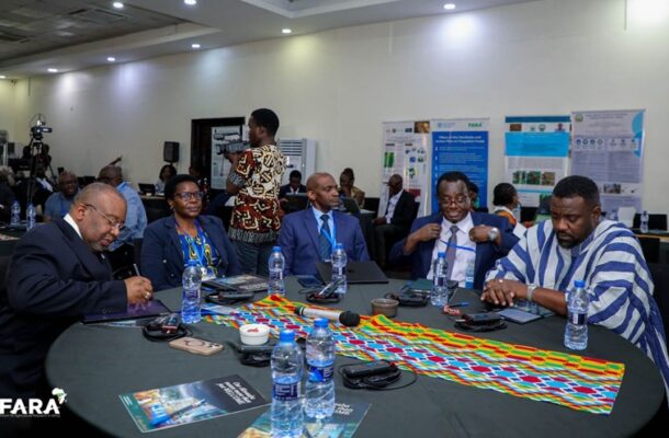 Group of professionals seated around a round table at a conference, with posters on the wall and water bottles visible. FARA logo bottom left.
