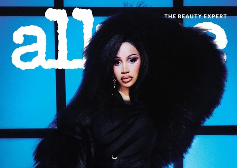 Woman wearing a dramatic black fur coat poses against a blue grid background with the word 'all' and 'THE BEAUTY EXPERT' visible.