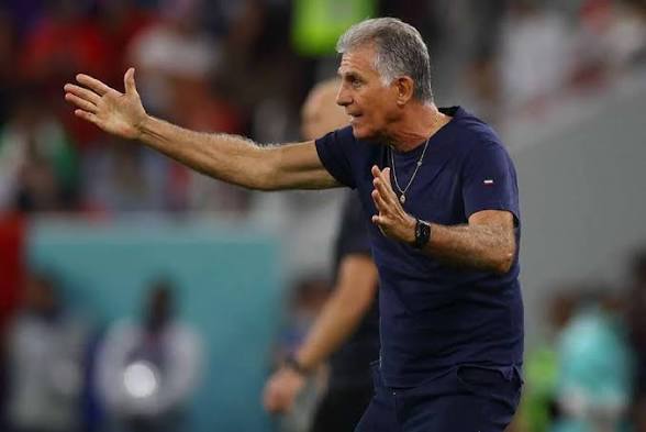 IMG_0056 | Ghanaguardian.com Athletic coach on a field gesturing with a left arm extended and right hand to chest, giving directions during a game.