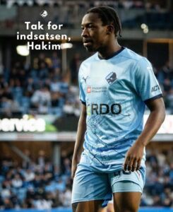 Footballer in a light-blue jersey on the field with a crowd in the background; text reads 'Tak for indsatsen, Hakim'.