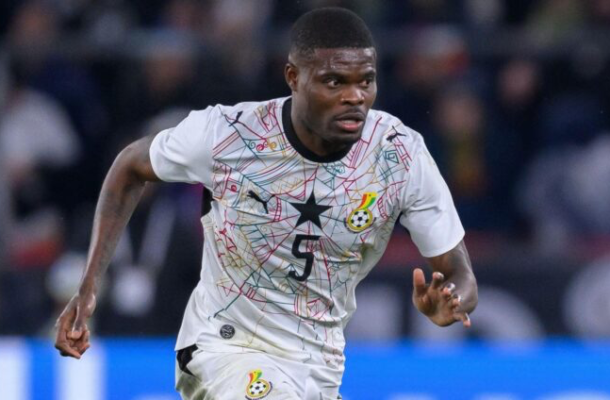 IMG_0819 | Ghanaguardian.com Ghana national team footballer in a white jersey with a colorful geometric pattern, sprinting on the field.