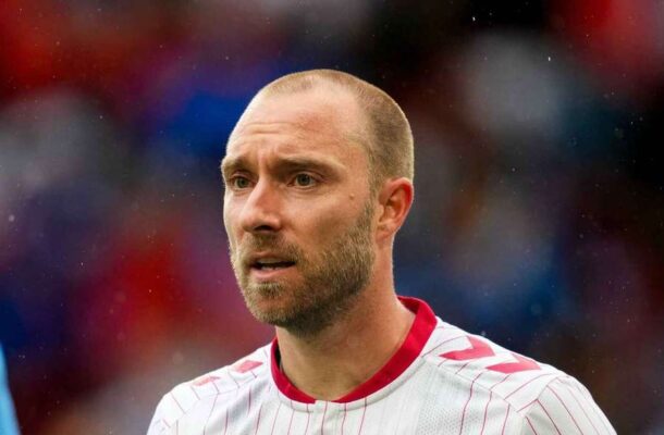 IMG_0861 | Ghanaguardian.com Close-up of a male soccer player with a shaved head and beard, wearing a white jersey with red trim, on the field.