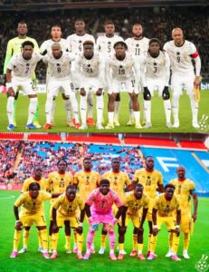 Soccer players in white uniforms form a lineup on the field before a match, with one team standing behind the other in yellow kits for a group photo.