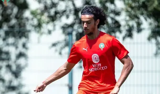 IMG_0935 | Ghanaguardian.com Soccer player in a red jersey dribbling on a sunny training field with a Visit Morocco logo on the chest