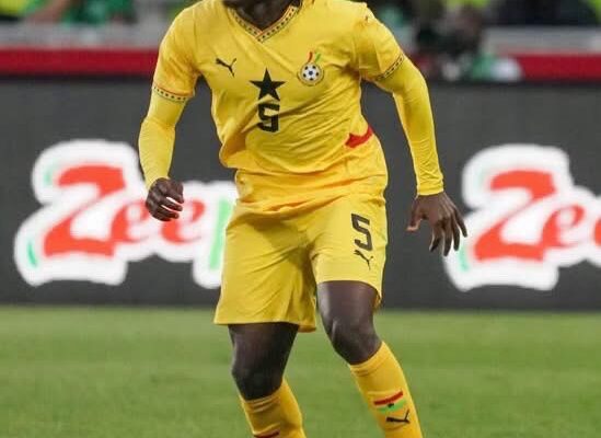 IMG_0978 | Ghanaguardian.com Action shot of a soccer player in a yellow uniform (number 5) sprinting on the pitch during a match.