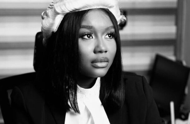 IMG_0994 | Ghanaguardian.com Black-and-white portrait of a woman in a blazer and white blouse, wearing a knit beret and looking upward to the right.