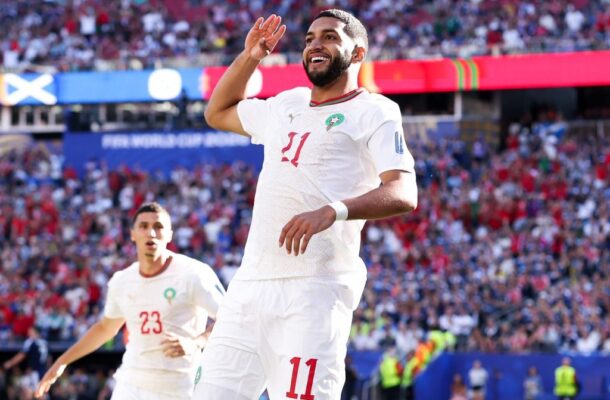 IMG_1002 | Ghanaguardian.com Soccer player wearing a white jersey number 11 salutes the crowd during a World Cup match, with a packed stadium behind him.