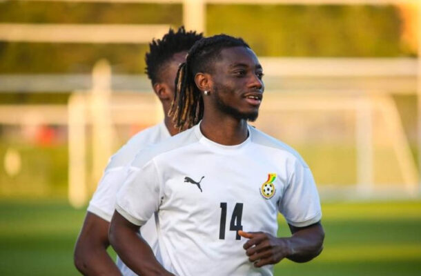 IMG_1008 | Ghanaguardian.com Soccer player in a white jersey with number 14, running on a practice field with goals in the background.