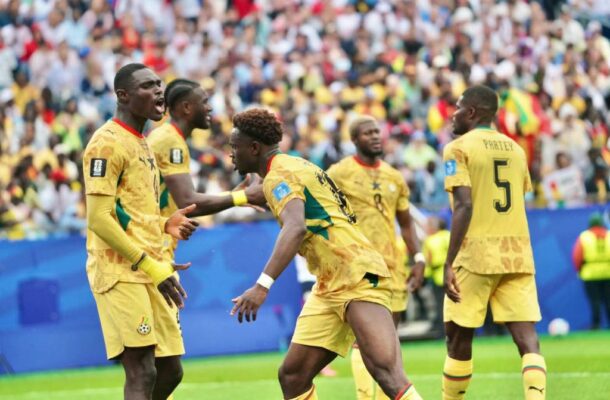 IMG_1039 | Ghanaguardian.com Soccer players in yellow uniforms celebrate on a green field as a crowd cheers in the stands behind them.