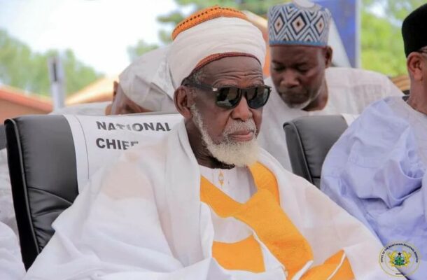 National-Chief-Imam | Ghanaguardian.com A senior man in traditional white robes and orange headwear sits in a chair labeled 'National Chief,' wearing dark sunglasses at a formal ceremony.