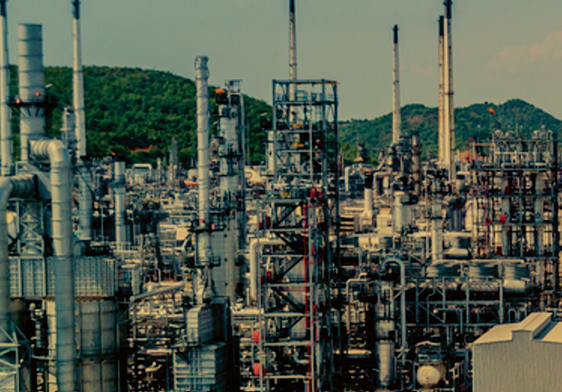 Screenshot-2026-06-08-194223 | Ghanaguardian.com Complex chemical refinery with dense network of pipes, towers, and processing equipment; green hills visible in the background.