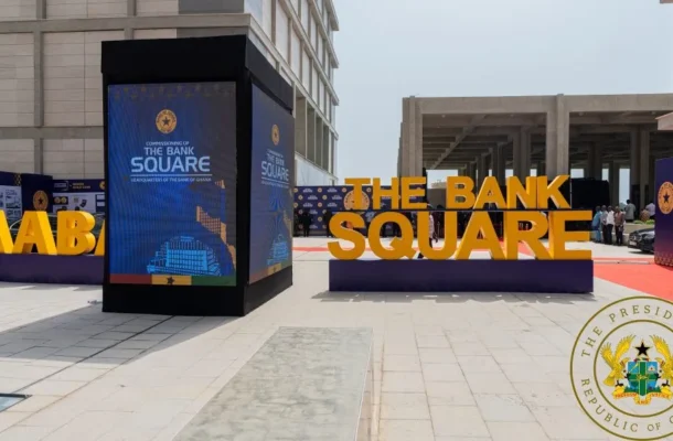 bog new head office | Ghanaguardian.com Promotional display reading THE BANK SQUARE with large orange letters at an outdoor event; blue info panels nearby and the presidential seal in the bottom-right corner.
