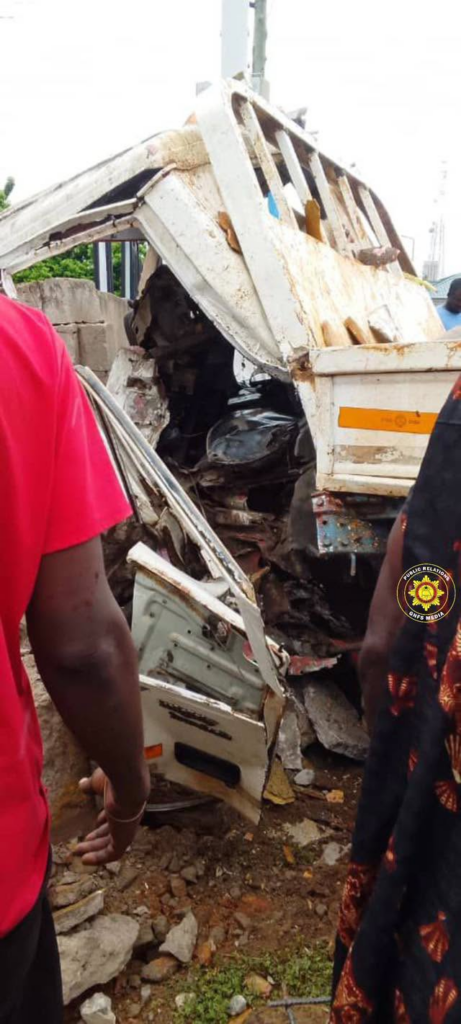 image-2921-461x1024-1 | Ghanaguardian.com Crushed white truck cab wedged in debris with bystanders in bright clothing nearby after a crash.