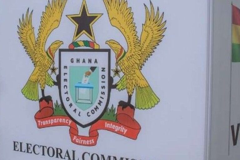 Ghana Electoral Commission seal with a shield, golden eagles, a star, and a red ribbon reading Transparency, Fairness, Integrity.