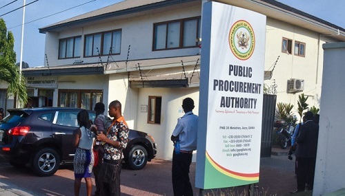 CREATOR gd-jpeg v10 using IJG JPEG v62 quality = 82 | Ghanaguardian.com People stand outside a government office next to a tall sign that reads Public Procurement Authority in bold letters on a sunny day.