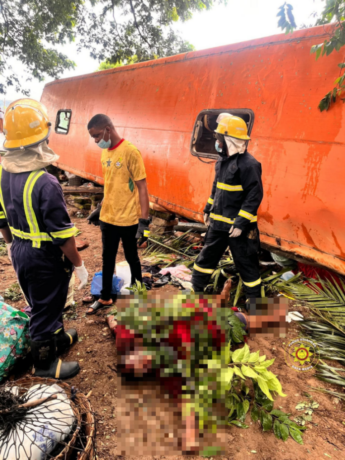 volta-accidents-696x927 | Ghanaguardian.com Emergency responders in helmets and turnout gear stand near an orange derailed train car, with a man in a yellow shirt and mask amid debris nearby.