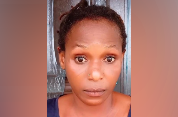 Close-up of a woman with short twists and a wide-eyed, surprised expression facing the camera.